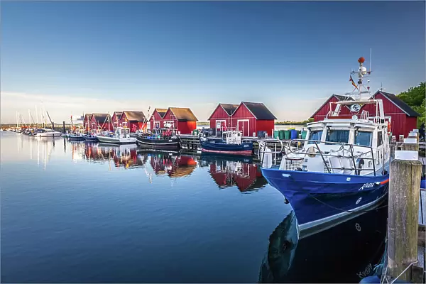 Fishing cutter and red boathouses in Marina Weisse Wiek in Boltenhagen, Mecklenburg-Western Pomerania, Baltic Sea, North Germany, Germany