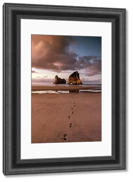 Footprints leading to Archway Islands, Wharariki Beach, South Island, New Zealand