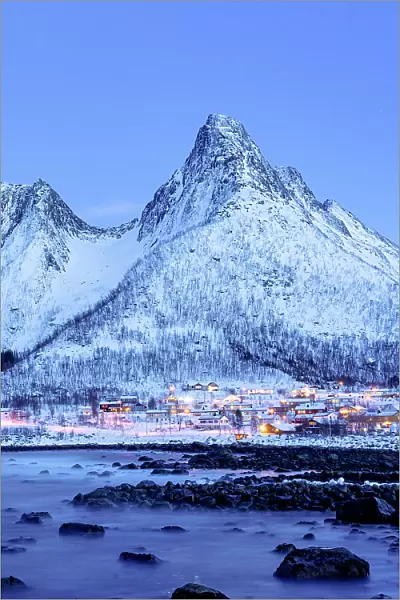 Fishing village of Mefjordvaer and snowy mountains at dusk, Senja, Troms county, Norway