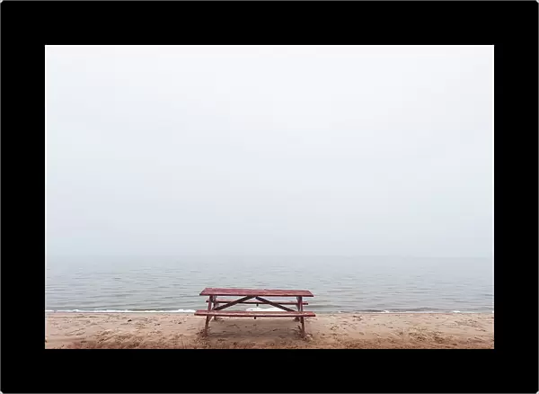 Picnic table on beach in fog St. Joseph's Island, Ontario, Canada