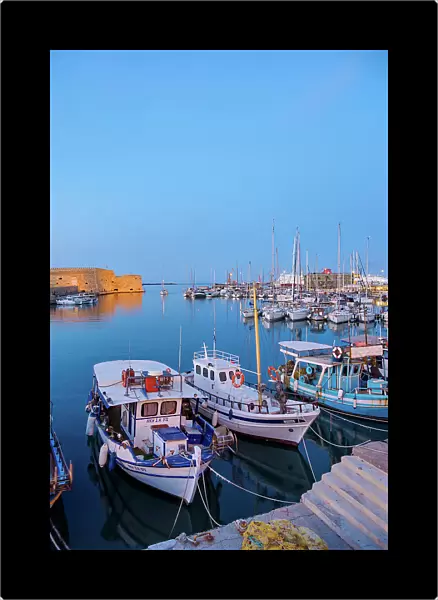 Old Venetian Port and The Koules Fortress at dusk, City of Heraklion, Crete, Greece