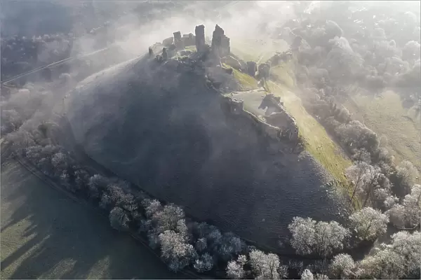 Aerial view of Corfe Castle on a chill winter morning, Dorset, England. Winter (February) 2023