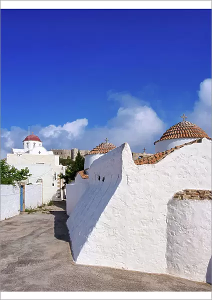 Whitewashed churches of Patmos Chora, Monastery of Saint-John the Theologian in the background, Patmos Island, Dodecanese, Greece