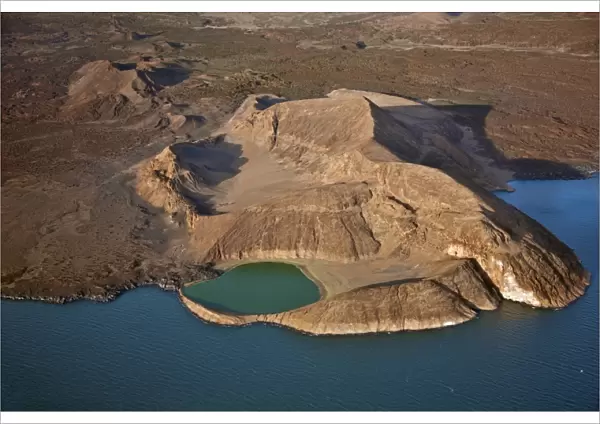 An extinct volcanic crater, Abil Agituk, at the southern end of Lake Turkana has a distinctively green crater lake which is fed by underground seepage from the