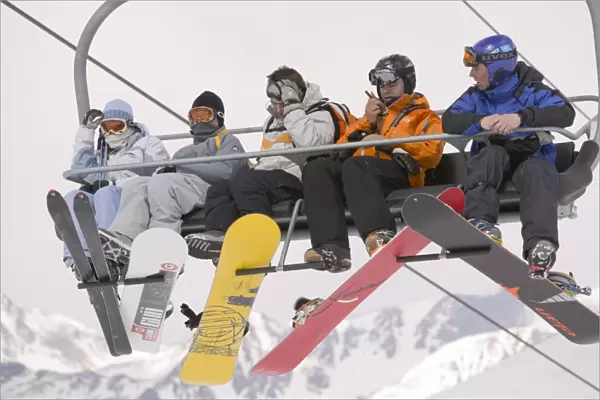 Skiers on a ski lift in the Andorran ski resort of Soldeu