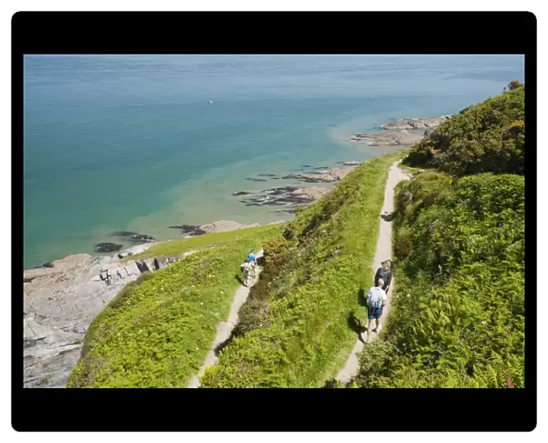 Walkers on the South West Coast Path near Combe Martin in Devon, UK