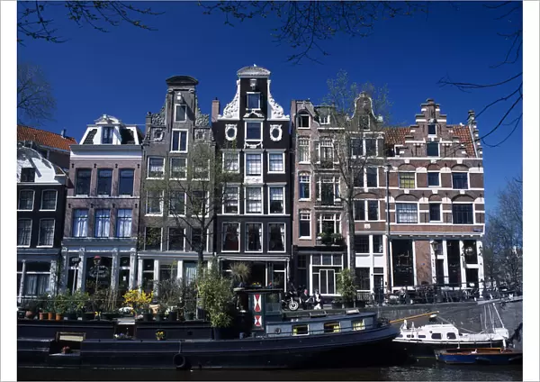 HOLLAND, Noord Holland, Amsterdam Traditional canal side house facades in the