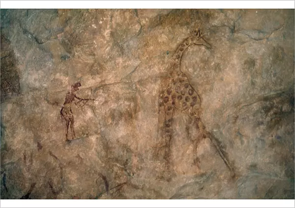 20076978. LIBYA Wadi Auis Detail of prehistoric rock art depicting giraffe and hunter