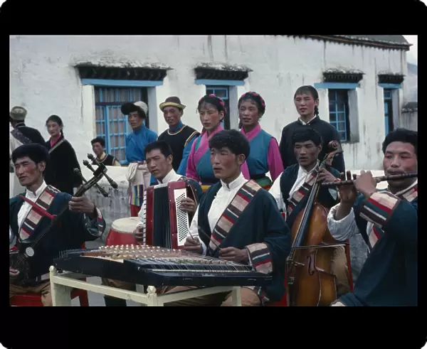 20076359. TIBET People Village orchestra and dancers in traditional dress