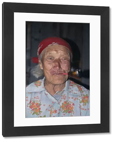 20056642. RUSSIA Lake Baikal Portrait of elderly Buryat woman smoking pipe
