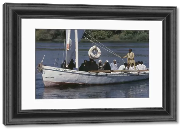 20076739. EGYPT Nile Valley Aswan Felucca sailboat full of passengers on the River Nile