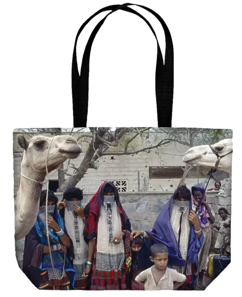 20040126. ERITREA North West Massawa Rashaida nomad women and children with camels