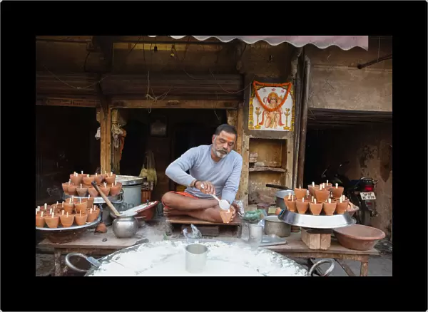 India, Uttar Pradesh, Allahabad, A vendor selling mishti doi sweet curd at a food hotel