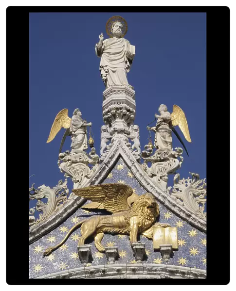 Italy, Veneto, Venice, Gold Lion of St Mark & statue of St Mark