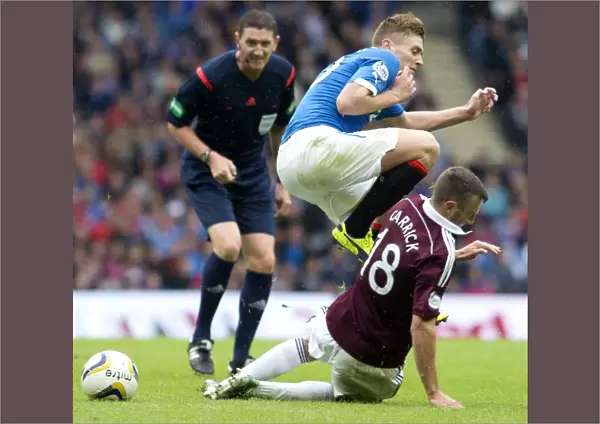 Leap of Faith: Rangers Macleod Soars Over Hearts Carrick in SPFL Championship Clash at Ibrox Stadium