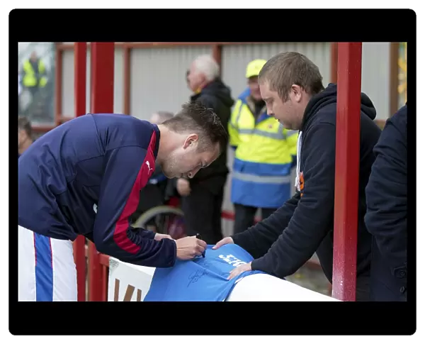 Rangers Defender Danny Wilson Signs Shirt at Fir Park during Motherwell vs Rangers - Betfred Cup Match