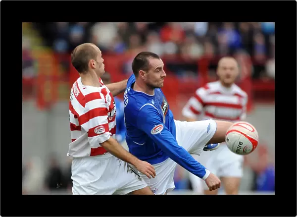 Rangers Kris Boyd Fights for Possession: Rangers Lead 1-0 Against Hamilton in Scottish Premier League