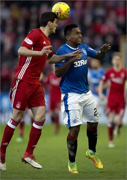 Intense Clash: Morelos Leaps for the Ball in Rangers vs Aberdeen's Ladbrokes Premiership Match at Pittodrie Stadium