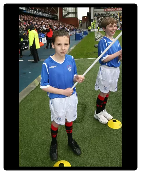 Rangers Flag Bearers Celebrate Victory: Triumphant Moment at Ibrox (1-0)