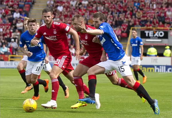 Intense Battle: Jon Flanagan Fights for Ball in Rangers vs Aberdeen Ladbrokes Premiership Clash at Pittodrie Stadium
