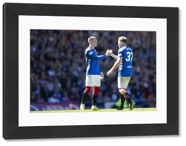 Rangers vs Celtic: Kent and Arfield Share a Moment at Ibrox Stadium - Scottish Premiership