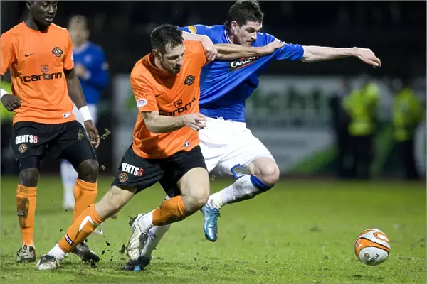 Rangers Kyle Lafferty Stands Strong Against Mihael Kovacevic in Intense Scottish FA Cup Clash: Dundee United vs Rangers (1-0)