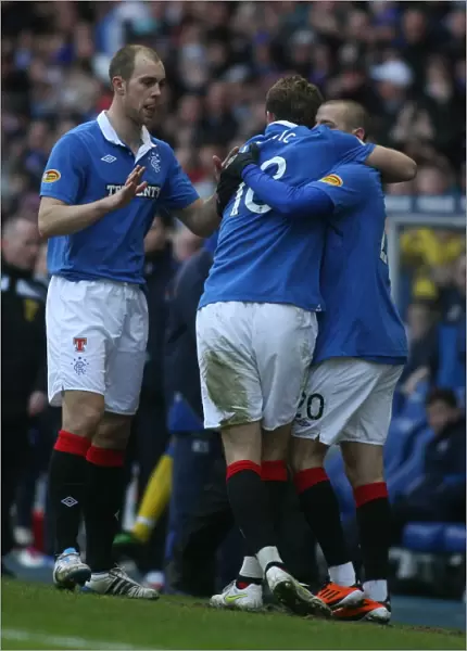 Rangers Triumphant Trio: Weiss, Whittaker, and Jelavic Celebrate Own Goal by Kilmarnock's Tim Clancy (Rangers 2-1)