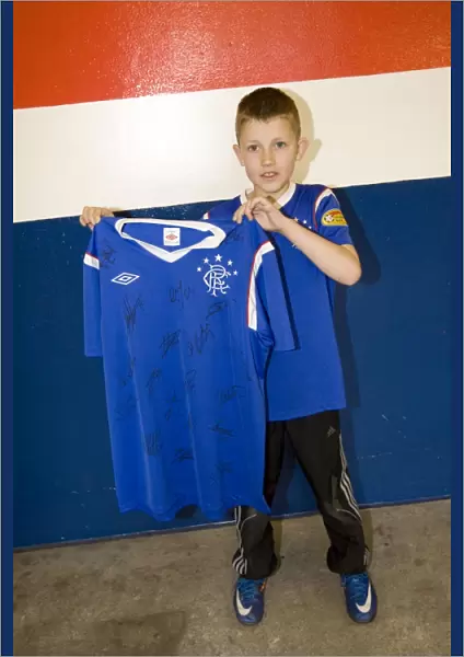 Family Fun at Ibrox: Marc Dickson's Exciting Shirt Winning Moment during Rangers vs. Heart of Midlothian Match