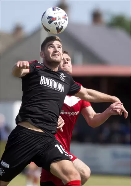 Rangers Kyle Hutton Heads the Ball to Secure 2-0 Victory Over Brora Rangers