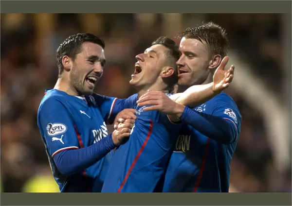 Rangers Aird, Clark, and Smith: Jubilant Moment as They Celebrate Goal in Scottish League One Against Dunfermline Athletic