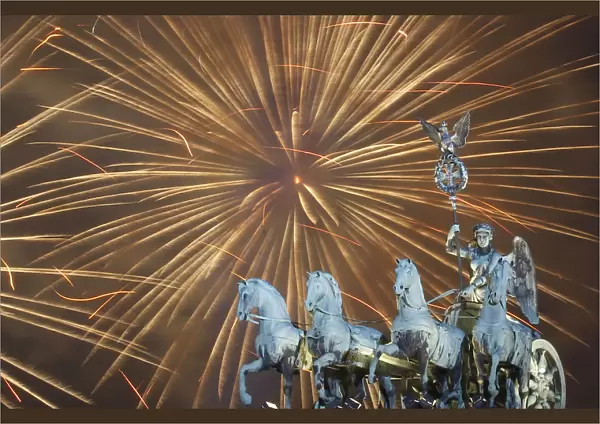 Fireworks explode during new year celebrations over the Brandenburger Tor gate in Berlin