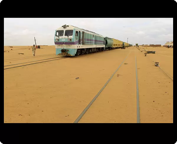 Railway tracks are covered by sand as a result of desert encroachment at Ogrein Railway