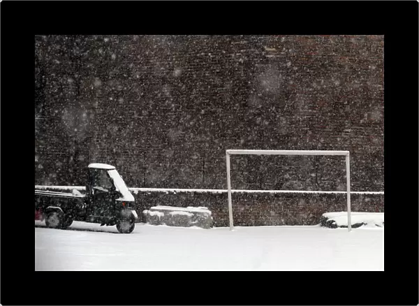 Soccer goalpost is seen during a snowstorm in Milan