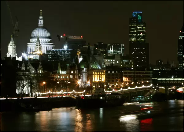 View of St Pauls Cathedral and Swiss Tower known as Gherkin on banks of River Thames