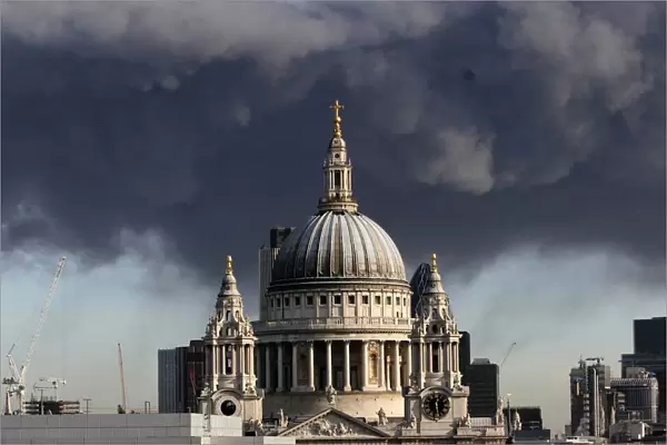 A plume of smoke hangs in the air behind St Pauls Cathedral in London