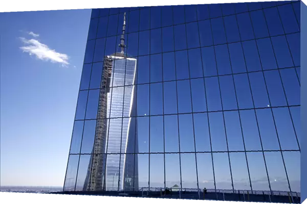 Reflection of the One World Trade Center tower is seen from a terrace on the 57th