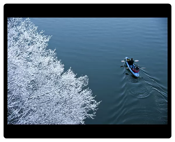Kayakers paddle on Unica River in Rakov Skocjan
