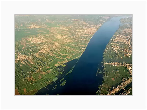 A general view of The Nile River, houses and agricultural land from the window of an