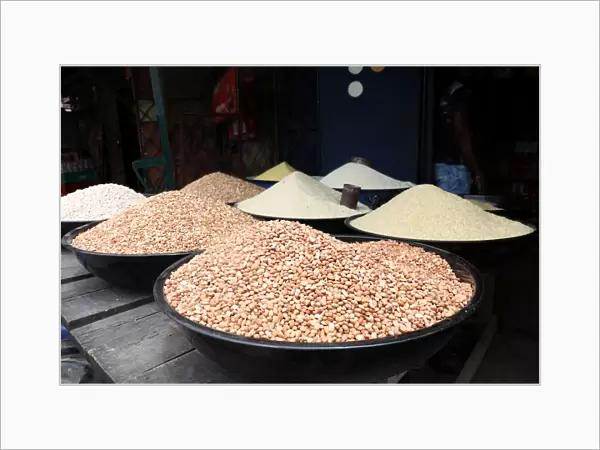 Beans and rice on display for sale are seen inside a shop at a market in Lagos