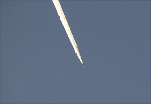 A Turkish fighter jet flies over the town of Hassa on the Turkish-Syrian border in Hatay