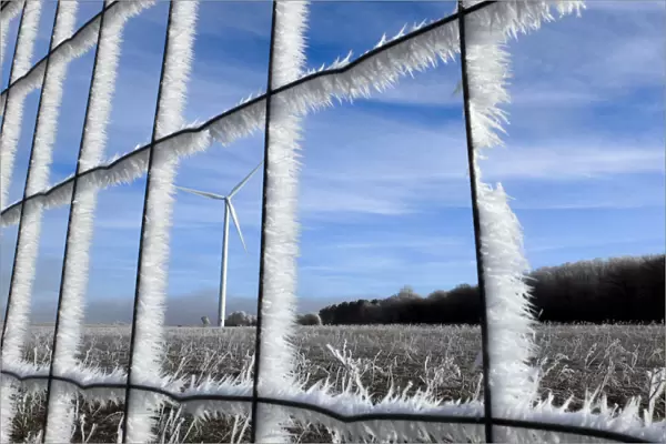 Fences and fields are covered with frost near the A6 highway also known as the Autoroute