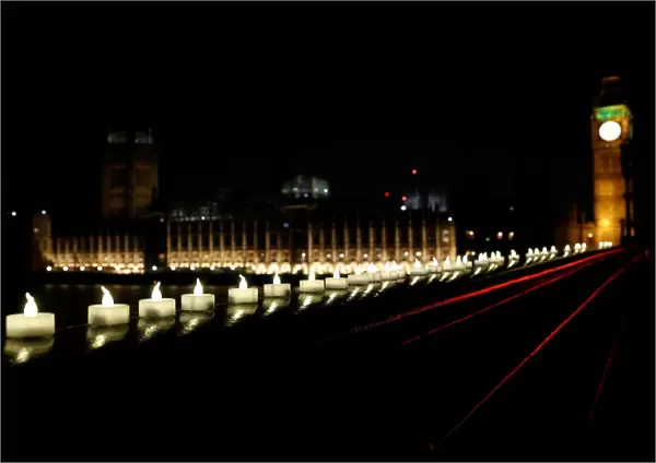 Candles burn on Westminster Bridge the day after an attack in London