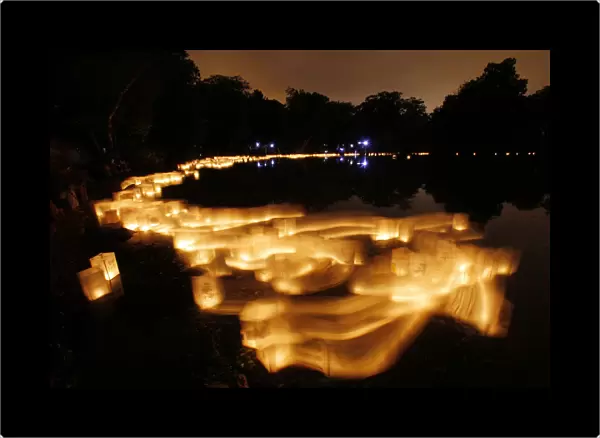 Paper lanterns float on Lake Hibiscus during the Forest Hills Lantern Festival at the