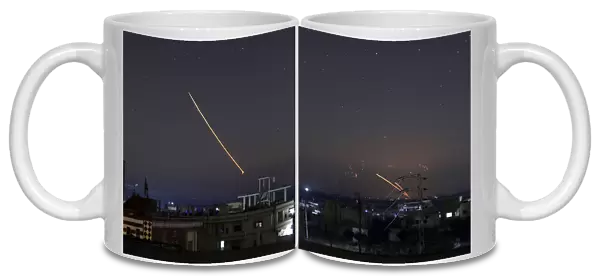 Missile fire is seen over Daraa