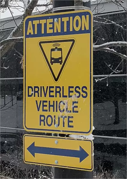 A sign marks part of a route used to test a driverless electric shuttle at the University