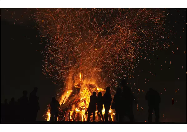 People attend a party held during the night of San Juan bonfire on the beach of Playa de