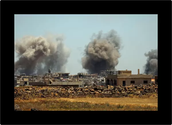 Smoke rises from al-Harak town, as seen from Deraa countryside