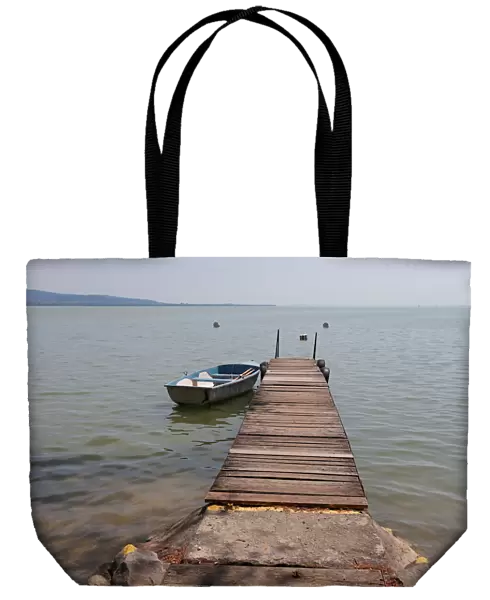 Boat is seen tied to a jetty on Lake Balaton in Keszthely