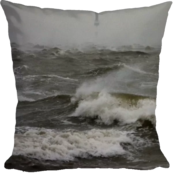 Waves at the North Sea are pictured at a quay wall in Cuxhaven