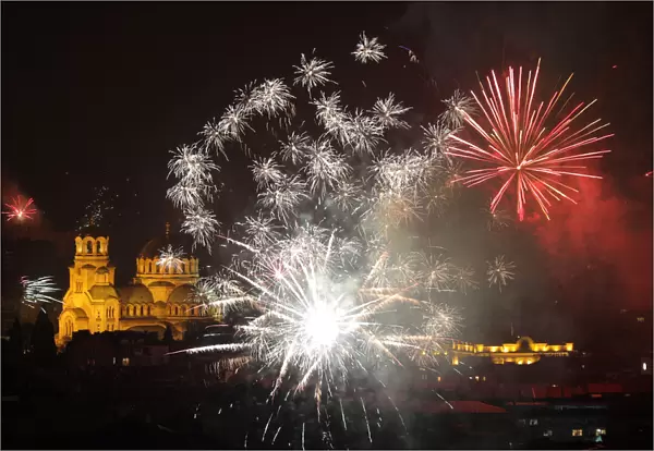 Fireworks explode over the Alexander Nevski cathedral during the New Year celebrations in
